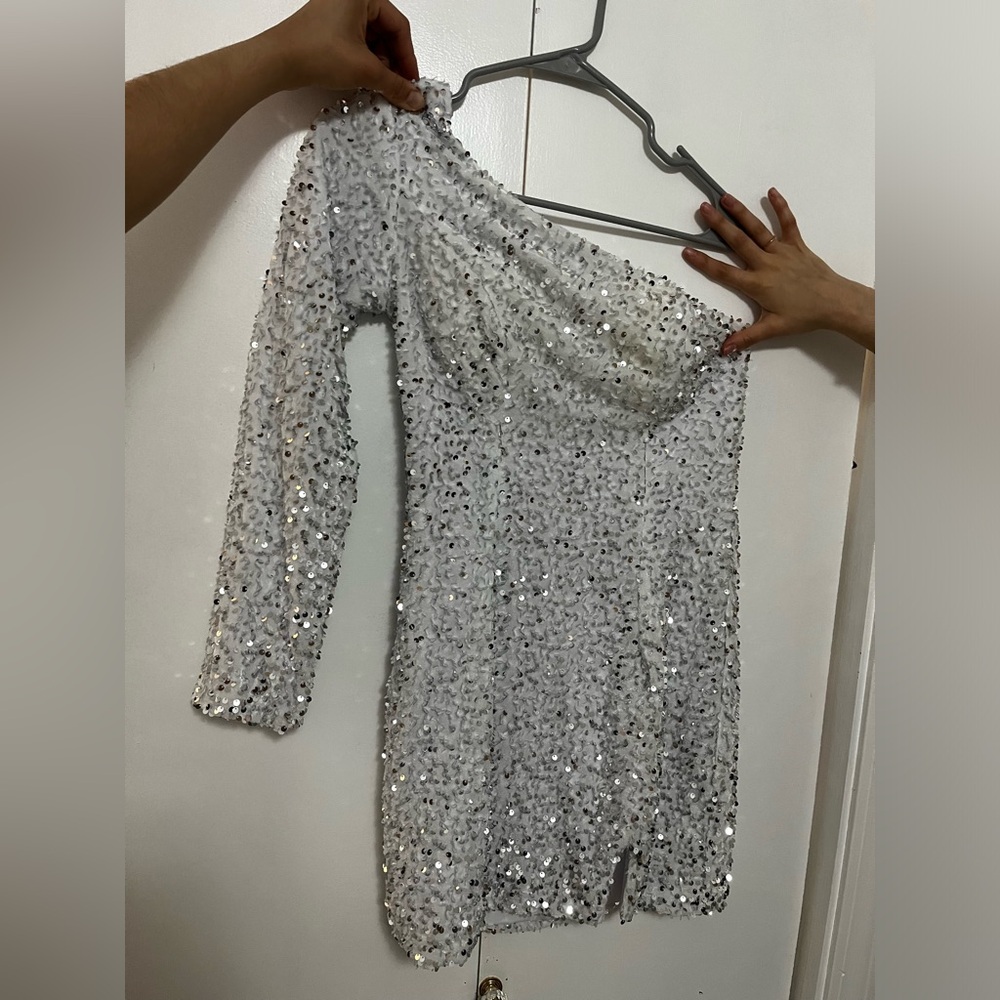 White dress with silver sequins.